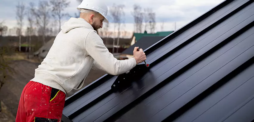 Tin Roof Ridge Cap Installation in Auburn